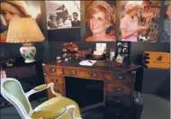  ?? ASSOCIATED PRESS ?? A display to mark the 20th anniversar­y of the death of Britain's Diana, Princess of Wales, a recreation of the desk where Princess Diana worked in her sitting room at Kensington Palace, on display at Buckingham Palace in London.