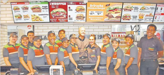  ?? Picture: ATU RASEA ?? Staff members of the new Burger King outlet at the Challenge Plaza in Laucala Beach yesterday.