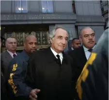  ?? Getty images FiLe ?? CANCELED: Bernard Madoff, seen being led out of federal court in Manhattan in 2009, has died in a prison medical facility in North Carolina.