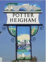  ??  ?? ABOVE: Potter Heigham’s village sign, showing the not-so-haunted bridge of a popular ghost story.