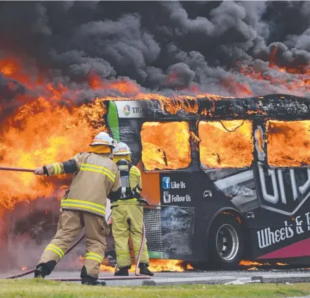  ?? Picture: DWAYNE NICOL ?? The Surfside bus on fire at Nerang yesterday and (below) the gutted remains.