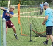  ?? Photo by Bob Parana ?? Post 467 assistant Casey Zimmerman and his son Aiden during hitting drills at Wednesday's practice. The Wilcox American Legion team hosts Brockway in Elk-McKean semifinal action tonight at the Jones Township Recreation­al Park (6 p.m.).