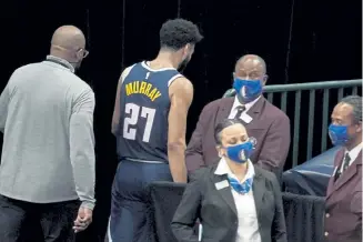  ?? Tony Gutierrez, The Associated Press ?? Nuggets guard Jamal Murray leaves the court after being ejected for hitting Dallas’ Tim Hardaway Jr. in the groin area in the second half on Monday night.