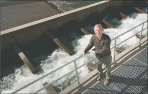  ??  ?? Woodbridge Irrigation District Manager Andy Christense­n poses for a photograph at the Woodbridge Dam fish ladder on Feb. 24, 2015.