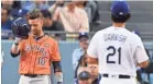  ?? ROBERT HANASHIRO/USA TODAY SPORTS ?? Yuli Gurriel tipped his helmet toward Yu Darvish in a show of respect before batting in Game 7 of the World Series.