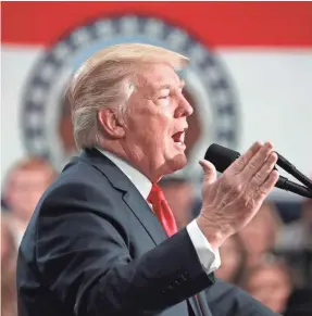  ??  ?? President Trump touts the proposed tax legislatio­n Wednesday at the St. Charles Convention Center in St. Charles, Mo. ANDREW HARNIK/AP