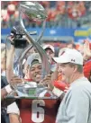  ?? ASSOCIATED PRESS ?? Wisconsin coach Paul Chryst and running back Corey Clement savored one of the Big Ten’s bowl victories.