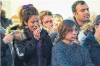  ?? GEOFF ROBINS AFP VIA GETTY IMAGES ?? A woman weeps during a service at Western University in London, Ont., Wednesday, to mourn the deaths of four of the school’s graduate students who were killed in the Tehran crash.