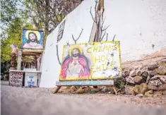  ??  ?? LEFT: Merchants sell many kinds of food, crafts and artwork, including “holy chile,” to throngs of visitors to Chimayó, particular­ly during Holy Week.