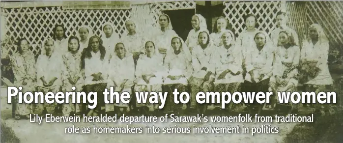  ?? ?? Archive photo shows Lily (seated, sixth right), who headed the Kuching MNU ‘Kaum Ibu’, in a group shot with Ajibah (seated, third left) and other members of the women’s section.