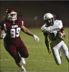  ?? PHOTO AARON BODUS ?? Junior running back Javier Contreras (24) attempts to run around a Kofa defender in Calexico’s 39-6 victory Friday night.