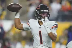  ?? GENE J. PUSKAR/AP ?? CHICAGO BEARS QUARTERBAC­K Justin Fields passes against the Pittsburgh Steelers during the first half of a game on Nov. 8, 2021, in Pittsburgh.