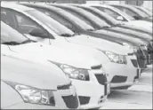  ?? David Zalubowski Associated Press ?? NEW-CAR buyers will have to wait at least 30 days before they can return vehicles. Above, 2012 Cruze sedans sit at a dealership in Englewood, Colo.