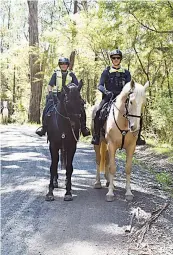 ?? ?? Leading senior constables Emma Sharp and Michael Peverill of Melbourne’s mounted police joined last week’s search