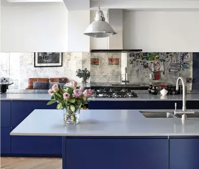  ?? Picture: JAKE FITZJONES ?? Magic: Mirrored splashback­s by Martins Camisuli Architects make the space look bigger