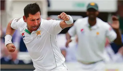  ?? AFP ?? Pakistan’s Yasir Shah picked up the wicket of Steven Finn to finish with a six-wicket haul as England were all out for 272 in the first innings of the first Test at Lord’s Cricket Ground in London on Friday.