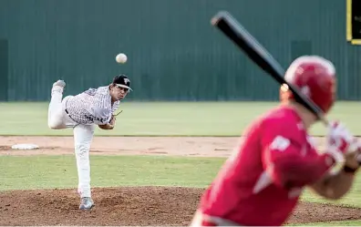  ?? Staff photo by Kayleigh Moreland ?? n Texarkana Twins’ Trey Morris pitches to an Acadiana Cane Cutters batter Monday at George Dobson Field at Spring Lake Park. The Twins came alive in the ninth inning to win, 7-6.