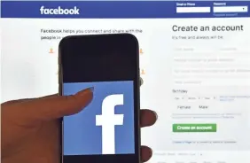  ?? CARL COURT/GETTY IMAGES ?? Facebook has tightened its process for developers that let users “sign in with Facebook.”