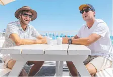  ?? ?? Surfers Jay Thompson (left) and Joel Parkinson discuss the new format for the 2024 Australian Boardrider­s Battle at Burleigh Heads. Picture: Andy Morris/Surfing Australia