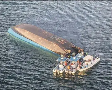  ?? AFP/Getty Images ?? THE MV NYERERE, which had a capacity of 101 passengers, lies overturned on Lake Victoria off Tanzania.