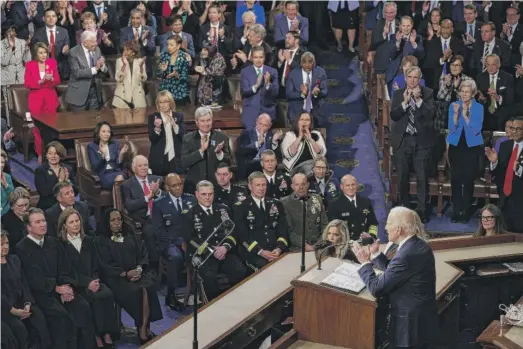  ?? CHIP SOMODEVILL­A/GETTY IMAGES ?? President Joe Biden delivers his State of the Union address in the House Chamber on Tuesday.