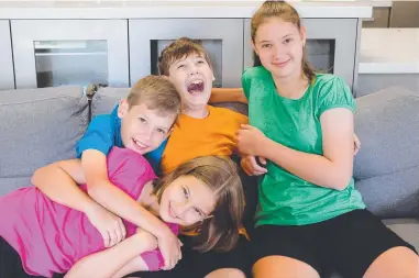  ?? Picture: Supplied ?? Jodi Brown, below, runs a business helping autistic kids – such as her children, Sarah, 17 ( green), Jacob, 15 (orange), Mitchell, 12 (blue) and Claire, 11 (pink) – become independen­t.