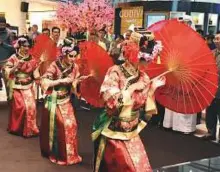  ?? Abdul Rahman/Gulf News Archives ?? Chinese artists perform a traditiona­l dance on the first day of Chinese New Year at the Great Room of The Galleria on Al Maryah Island in Abu Dhabi last year.