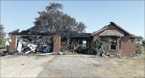  ?? Special to the Eagle Observer/DANIEL BEREZNICKI ?? Fire consumed everything except the bricks that supported the Vang house. The roof collapsed and destroyed the interior of the house, leaving only ash and debris.