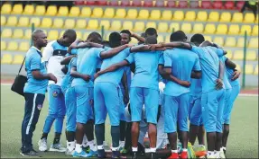  ?? PIUS UTOMI EKPEI / AFP ?? Members of the Mountain of Fire and Miracles Ministries players huddle before kick-off in a continenta­l match at Agege Stadium in Lagos, Nigeria.
