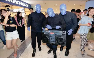  ??  ?? The Blue Man Group make an appearance at a shopping mall in Shanghai, China on Thursday. They will perform in Cape Town from March 21 to 26.