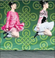  ?? ANDA CHU – STAFF PHOTOGRAPH­ER ?? Left and above: Members of the McGrath Irish Dancers perform at Dublin’s St. Patrick’s Day weekend festival celebratio­n Saturday. The city’s celebratio­n also included the 35th annual Dublin Lions Club St. Patrick’s Day Parade.