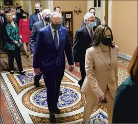  ?? Kent Nishimura Los Angeles Times ?? VICE PRESIDENT Kamala Harris and members of a closely divided Congress make their way to President Biden’s major speech Wednesday in the Capitol.