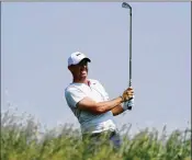  ?? RICHARD HEATHCOTE / GETTY IMAGES ?? “It’s a U.S. Open. It’s supposed to be a tough test,” says Rory McIlroy of the knee-high fescue bordering some fairways at Erin Hills.
