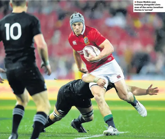  ??  ?? > Owen Watkin says training alongside Lions man of the series Jonathan Davies is ‘surreal’