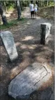  ?? MICHAEL DWYER — THE ASSOCIATED PRESS FILE ?? In this file photo, a stone inscriptio­n marks the actual site of Henry David Thoreau’s cabin on the shores of Walden Pond in Concord, Mass.