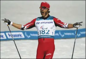  ?? AP PHOTO ?? Canada’s Brian Mckeever celebrates his victory in the men’s 1.5km sprint classic at the Paralympic Winter Games yesterday.