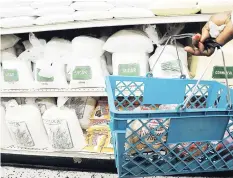  ??  ?? A shopper walks through the isle of a grocery store. The goods and services that Jamaicans regularly buy are tracked by Statin in order to measure inflation. Every 10 years or so, Statin conducts a Household Expenditur­e Survey to refresh the list.