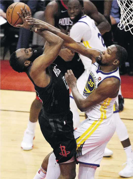  ?? — THE ASSOCIATED PRESS ?? Rockets guard James Harden, left, battles Golden State Warriors forward Kevin Durant during Game 1 of the Western Conference Finals on Monday in Houston, Texas. Harden led all scorers with 41 points in the losing cause.