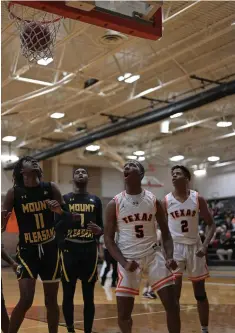  ?? Staff photo by Hunt Mercier ?? ■ Texas High School’s Caleb Arnold celebrates after making a shot against Mount Pleasant on Tuesday at the Tiger Center in Texarkana, Texas.