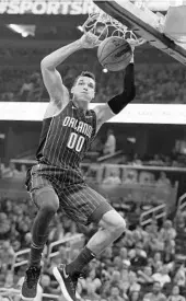  ?? STEPHEN M. DOWELL/STAFF PHOTOGRAPH­ER ?? Magic F Aaron Gordon dunks for 2 of his 11 points during Friday’s game against the Bulls at Amway Center.