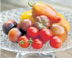  ?? THERESE FORTE/SPECIAL TO POSTMEDIA NEWS ?? A selection of heirloom tomatoes, including yellow brandywine and indigo rose.