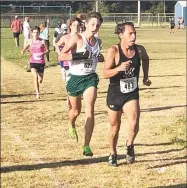  ?? RICK PECK/SPECIAL TO MCDONALD COUNTY PRESS ?? McDonald County’s David Lazalde leads Anthony Mancuso of Springfiel­d Catholic on the way to a 14th place finish at the Big 8 Conference Boys Cross Country Championsh­ips held Oct. 14 at East Newton High School.