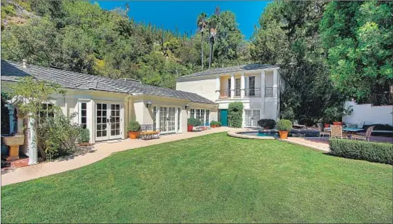  ?? Hilton & Hyland ?? KATY PERRY is asking $ 7.95 million for this 4,400- square- foot home, the smaller of her two Beverly Hills Post Office properties.