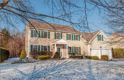  ?? Photos by Kristi B Photograph­y ?? The home at 41 Jean Place, Guilderlan­d, is 3,582 square feet. At left is the lviing room.