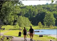  ?? MEDIANEWS GROUP FILE PHOTO ?? People walk along a path at Green Lane Park in Montgomery County.