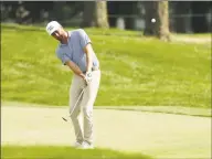  ?? Gregory Shamus / Getty Images ?? Chris Kirk plays his fourth shot on the 17th hole during the second round of the Rocket Mortgage Classic on Friday at the Detroit Golf Club.