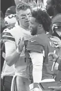  ?? GETTY IMAGES ?? Cowboys quarterbac­k Andy Dalton, left, congratula­tes Cardinals quarterbac­k Kyler Murray after Monday night’s game.