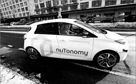  ?? STEVEN SENNE/AP ?? Surveys show about 70 percent of people think autonomous vehicles will be commonplac­e in 15 years — yet most say they are unwilling to ride in one.