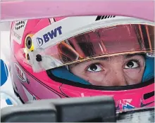  ?? RYAN REMIORZ THE CANADIAN PRESS ?? Force India driver Nicholas Latifi gets ready for the first practice session.