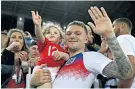  ??  ?? Star of the show: Kieran Trippier with his son after his excellent performanc­e